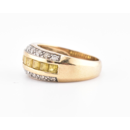 245 - A hallmarked 9ct gold, yellow sapphire and diamond ring. The 9ct yellow gold ring having a central r... 