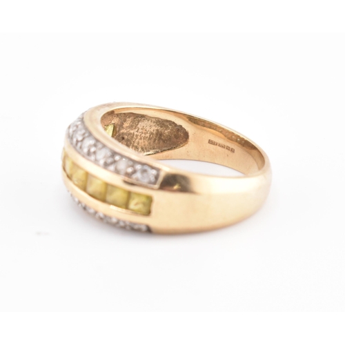 245 - A hallmarked 9ct gold, yellow sapphire and diamond ring. The 9ct yellow gold ring having a central r... 