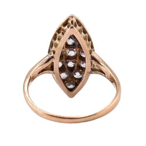 24A - A gold and diamond navette ring. The gold yellow gold navette ring set with fifteen old cut diamonds... 