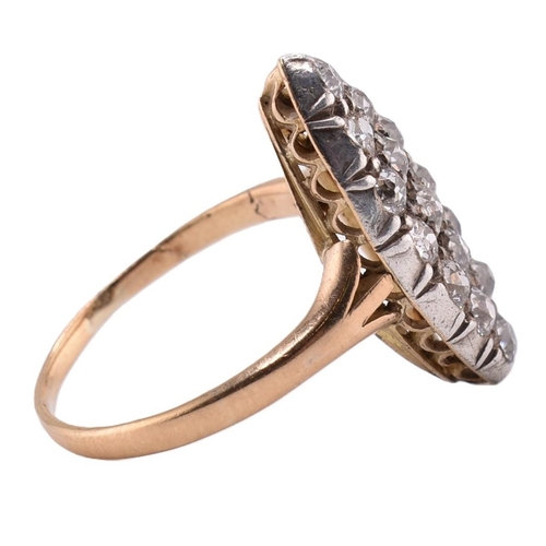 24A - A gold and diamond navette ring. The gold yellow gold navette ring set with fifteen old cut diamonds... 