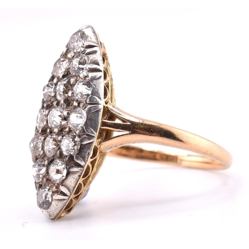 24A - A gold and diamond navette ring. The gold yellow gold navette ring set with fifteen old cut diamonds... 