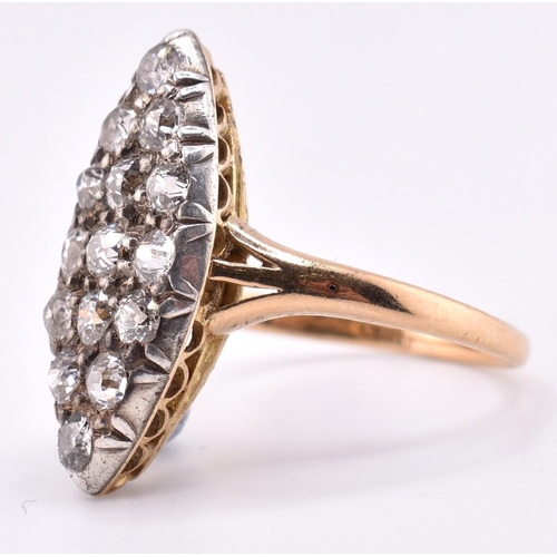 24A - A gold and diamond navette ring. The gold yellow gold navette ring set with fifteen old cut diamonds... 