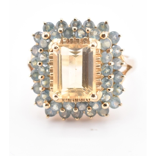 250 - A hallmarked 9ct gold, citrine and alexandrite cluster ring. The 9ct yellow gold ring set with a cen... 