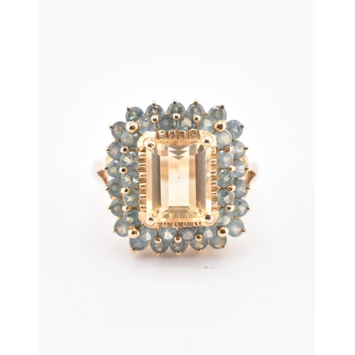 250 - A hallmarked 9ct gold, citrine and alexandrite cluster ring. The 9ct yellow gold ring set with a cen... 