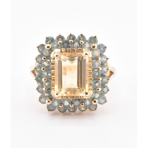 250 - A hallmarked 9ct gold, citrine and alexandrite cluster ring. The 9ct yellow gold ring set with a cen... 