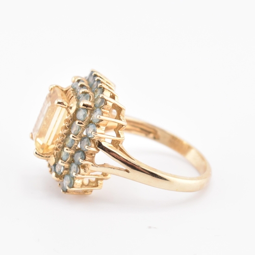 250 - A hallmarked 9ct gold, citrine and alexandrite cluster ring. The 9ct yellow gold ring set with a cen... 