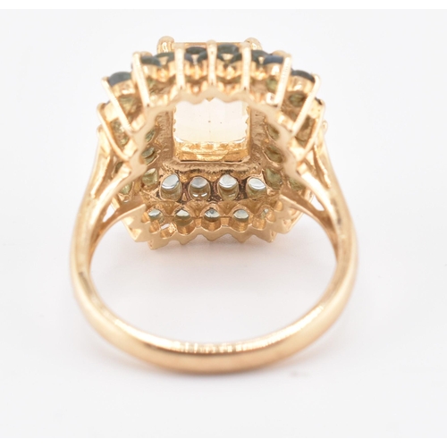 250 - A hallmarked 9ct gold, citrine and alexandrite cluster ring. The 9ct yellow gold ring set with a cen... 