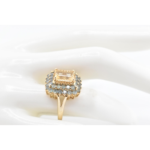 250 - A hallmarked 9ct gold, citrine and alexandrite cluster ring. The 9ct yellow gold ring set with a cen... 