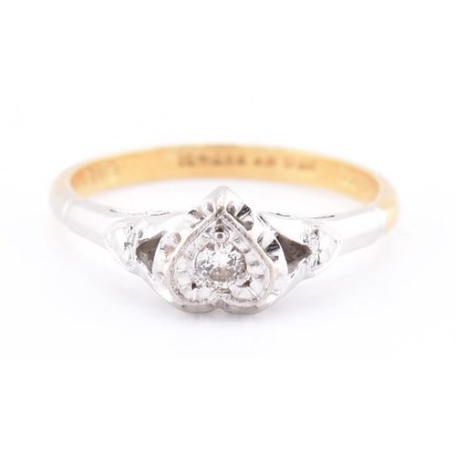 251 - A 1950s 18ct gold and platinum diamond solitaire heart ring. The 1950s 18ct yellow gold and platinum... 