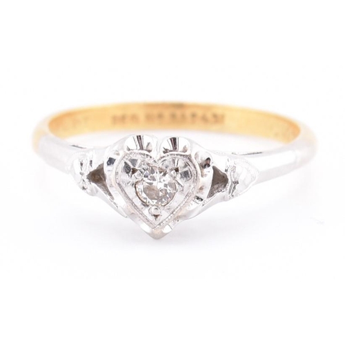 251 - A 1950s 18ct gold and platinum diamond solitaire heart ring. The 1950s 18ct yellow gold and platinum... 