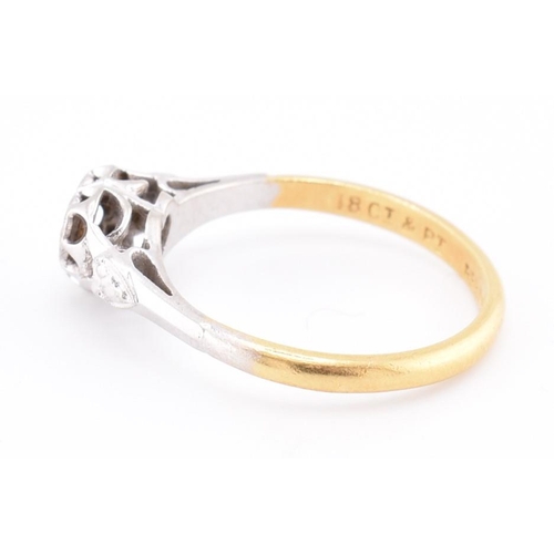 251 - A 1950s 18ct gold and platinum diamond solitaire heart ring. The 1950s 18ct yellow gold and platinum... 