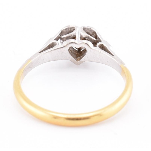 251 - A 1950s 18ct gold and platinum diamond solitaire heart ring. The 1950s 18ct yellow gold and platinum... 