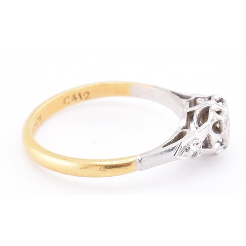 251 - A 1950s 18ct gold and platinum diamond solitaire heart ring. The 1950s 18ct yellow gold and platinum... 