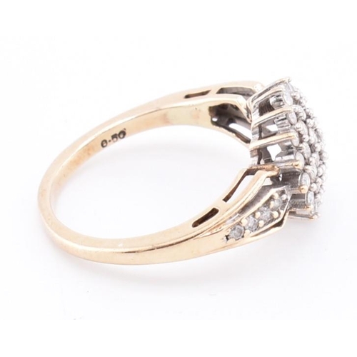 254 - A hallmarked 9ct gold and diamond cluster ring. The 9ct yellow gold ring set with a round cluster of... 