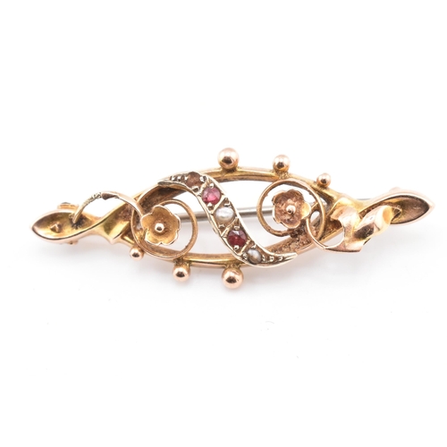 256 - A 9ct gold garnet & pearl brooch pin together with a hallmarked 9ct gold cross pendant necklace.... 