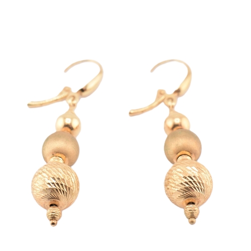 258 - A pair of 9ct gold graduated ball drop pendant earrings having lever clasps. Marked 375. Weighs 3.3g... 