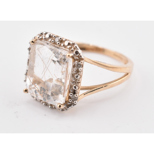 262 - A hallmarked 9ct gold rutile quartz and diamond ring. The 9ct yellow gold ring having a central octa... 