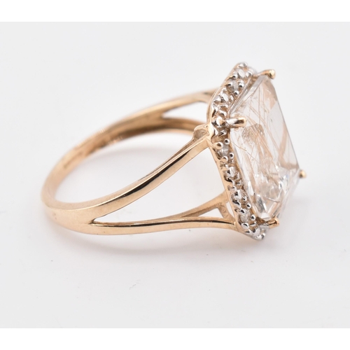 262 - A hallmarked 9ct gold rutile quartz and diamond ring. The 9ct yellow gold ring having a central octa... 