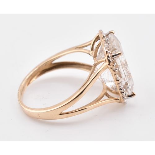 262 - A hallmarked 9ct gold rutile quartz and diamond ring. The 9ct yellow gold ring having a central octa... 