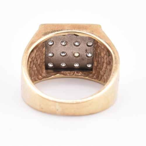 265 - A hallmarked 9ct gold and diamond signet ring. The 9ct yellow gold ring having 16 round brilliant cu... 