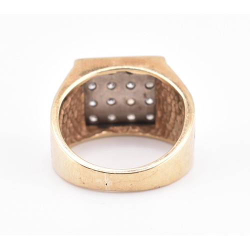 265 - A hallmarked 9ct gold and diamond signet ring. The 9ct yellow gold ring having 16 round brilliant cu... 