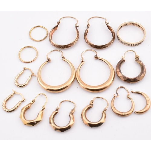 267 - A collection of 9ct gold earrings AF and band ring. The earrings to include three pairs of 9ct gold ... 