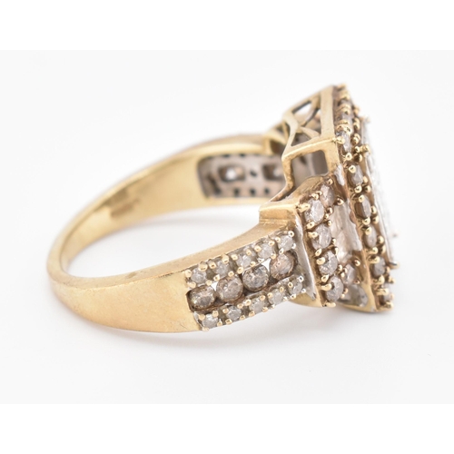 270 - A hallmarked 9ct gold, white and champagne diamond ring. The 9ct yellow gold ring set with 15 square... 