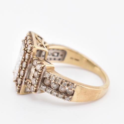 270 - A hallmarked 9ct gold, white and champagne diamond ring. The 9ct yellow gold ring set with 15 square... 