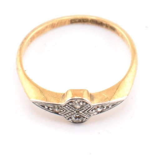 42 - An Art Deco 18ct gold and platinum diamond ring. The 18ct gold ring set with four round brilliant cu... 