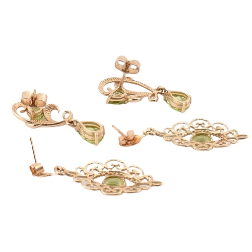 44 - Two pairs of hallmarked 9ct gold and peridot pendant earrings. The earrings to include a pair of hal... 