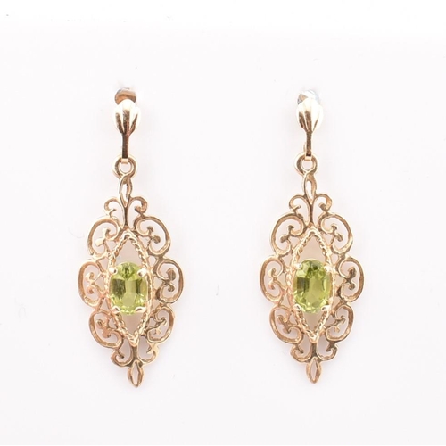 44 - Two pairs of hallmarked 9ct gold and peridot pendant earrings. The earrings to include a pair of hal... 