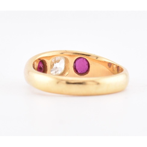 46 - An 18ct gold ruby and diamond gypsy ring. The 18ct yellow gold gypsy ring set with a central rubover... 