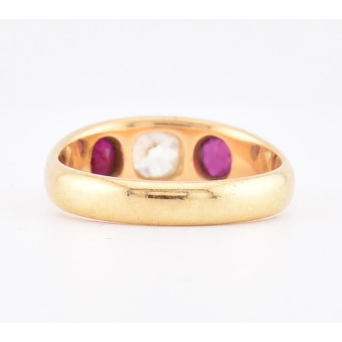 46 - An 18ct gold ruby and diamond gypsy ring. The 18ct yellow gold gypsy ring set with a central rubover... 