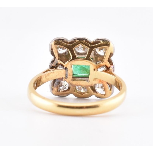 5 - An 18ct gold and platinum, emerald and diamond cluster ring. The 18ct yellow gold ring having a cent... 