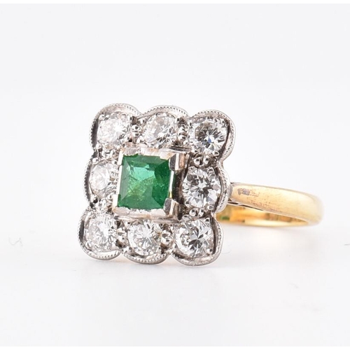 5 - An 18ct gold and platinum, emerald and diamond cluster ring. The 18ct yellow gold ring having a cent... 