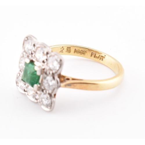 5 - An 18ct gold and platinum, emerald and diamond cluster ring. The 18ct yellow gold ring having a cent... 