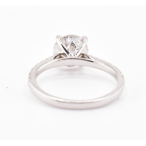 50 - A platinum and laboratory-grown diamond engagement ring. The engagement style ring having a central ... 