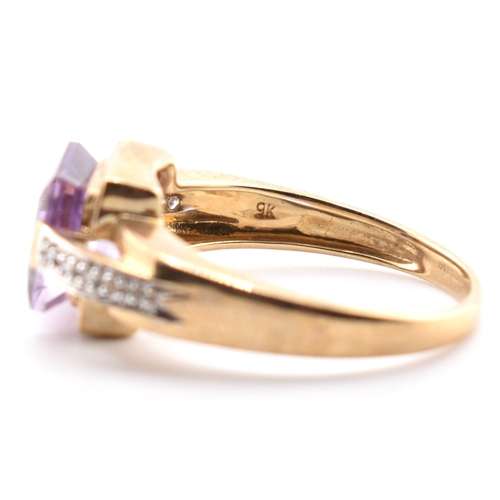 513 - A hallmarked 9ct gold amethyst and diamond ring. The ring set with a central step-cut amethyst to di... 