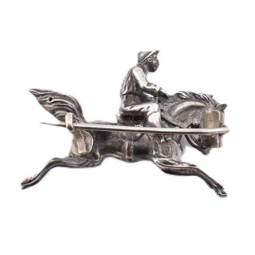 54 - A 19th century Victorian white metal novelty horse and Jockey brooch pin. The brooch in the form of ... 