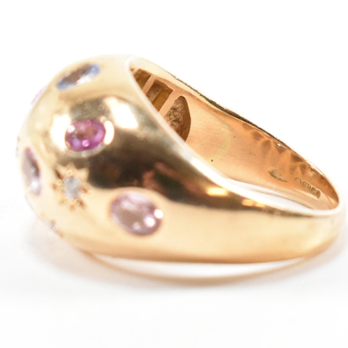 54a - A hallmarked 18ct gold sapphire and diamond set dome ring. Hallmarked Birmingham, 2009, sponsors mar... 