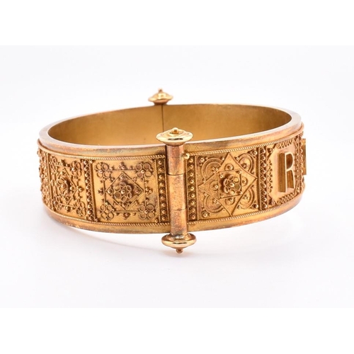 55 - A Victorian gold Roma Etruscan style bangle cased. The Victorian gold Archaeological Revival hinged ... 