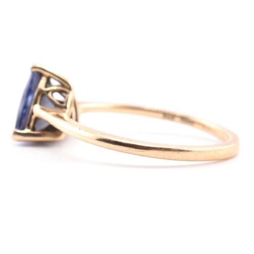 58 - A hallmarked 14 ct gold and Tanzanite Tomas Rae ring. The 14ct yellow gold ring set with a single tr... 