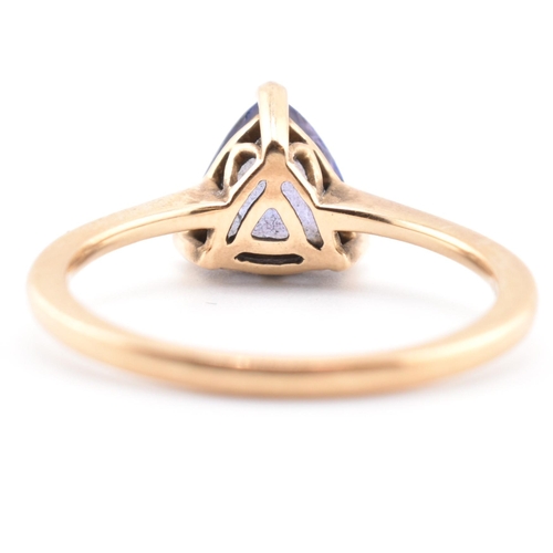 58 - A hallmarked 14 ct gold and Tanzanite Tomas Rae ring. The 14ct yellow gold ring set with a single tr... 