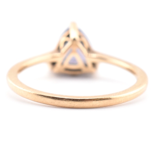 58 - A hallmarked 14 ct gold and Tanzanite Tomas Rae ring. The 14ct yellow gold ring set with a single tr... 