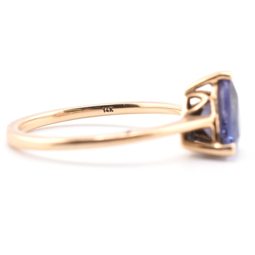 58 - A hallmarked 14 ct gold and Tanzanite Tomas Rae ring. The 14ct yellow gold ring set with a single tr... 