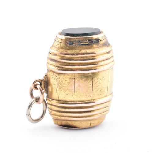 62 - A 19th-century gold and bloodstone barrel charm. The gold barrel charm having a bloodstone mounted c... 