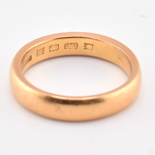 64 - A hallmarked 22ct gold band ring. The 22ct yellow gold band ring hallmarked for London, 1927. Maker'... 