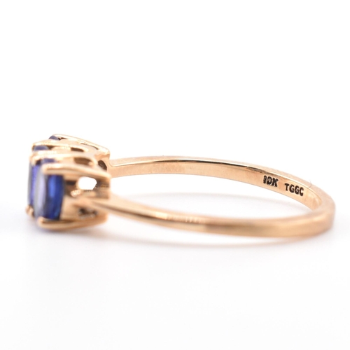 68 - A hallmarked 9ct gold and tanzanite three stone ring. The ring set with three four-prong set oval cu... 