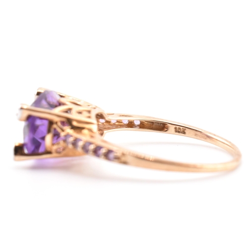 73 - A hallmarked 9ct Rio Grande amethyst and diamond ring. The ring having an east-west set oval cut Rio... 