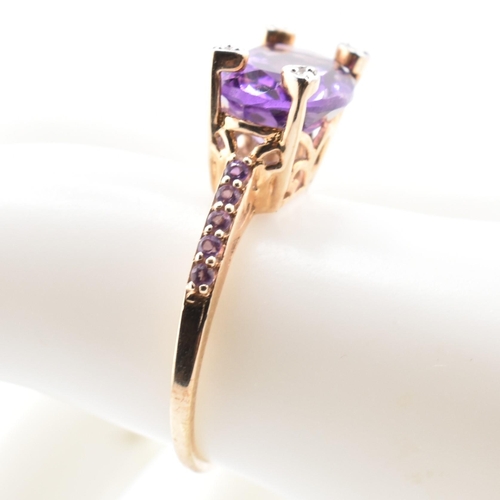 73 - A hallmarked 9ct Rio Grande amethyst and diamond ring. The ring having an east-west set oval cut Rio... 